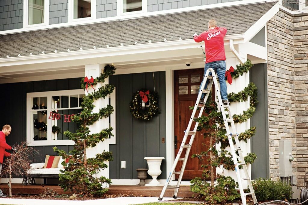 Shine’s team performing their holiday light installation services