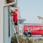 shine-employee-cleaning-window