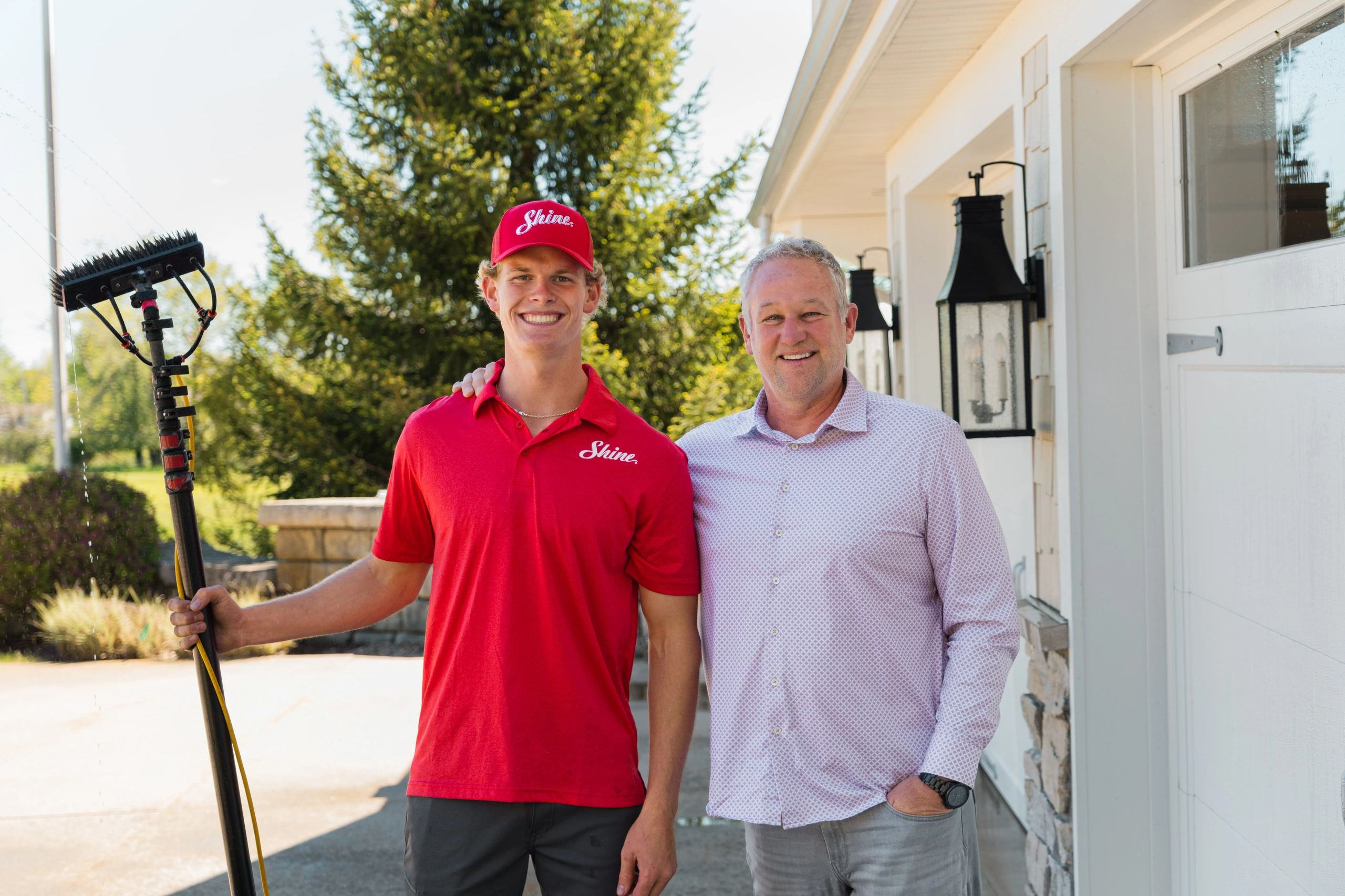 Shine founders Chris and Michelle standing together outside a home