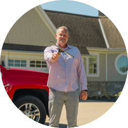 Shine founder standing beside a branded van