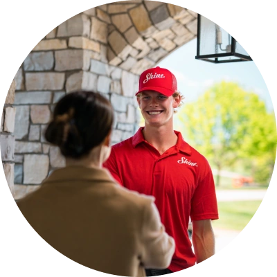 Shine technician talking with a homeowner