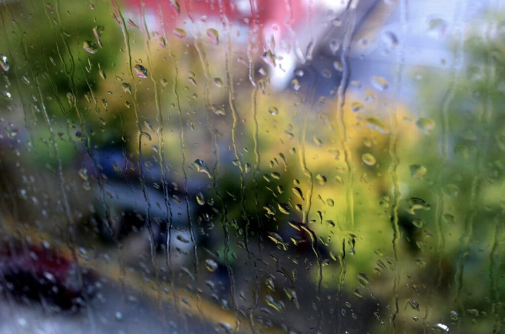 A window covered in rain