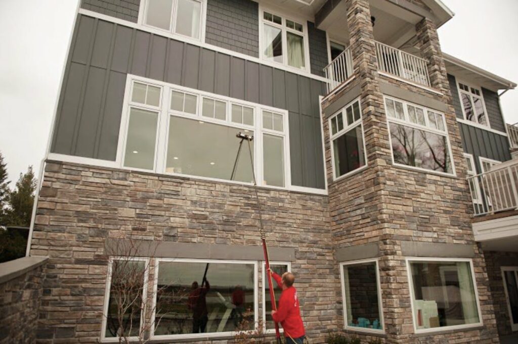 A Shine technician cleaning hard-to-reach windows