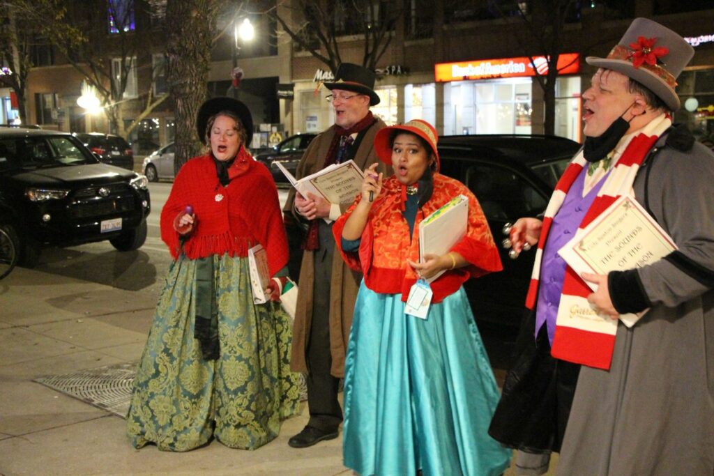 Caroling with the Southport Holiday Stroll & Cocktail Crawl 