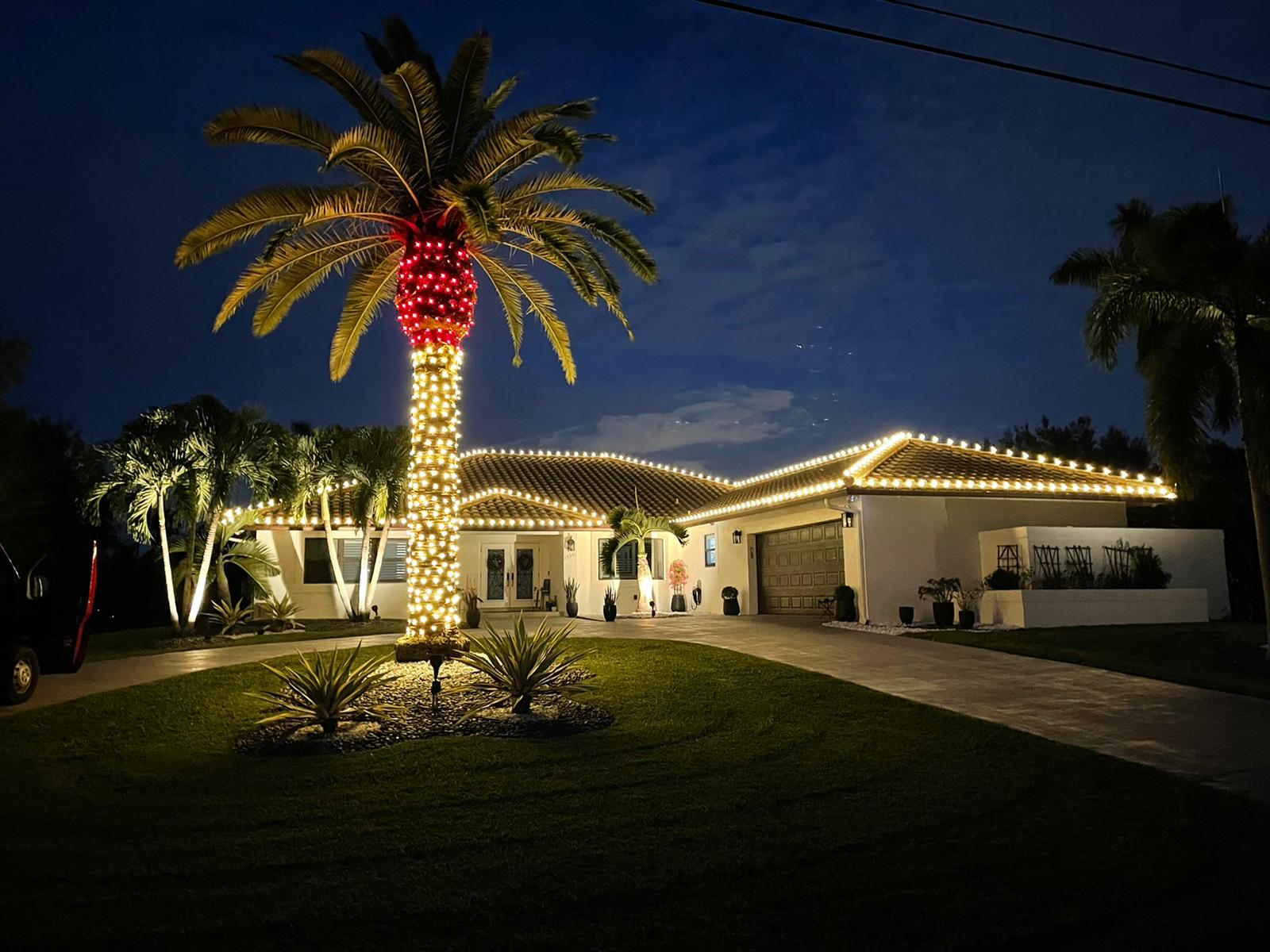 Close-up of warm lighting installed under residential roof eaves