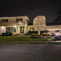 House with holiday lighting installed by shine of long island